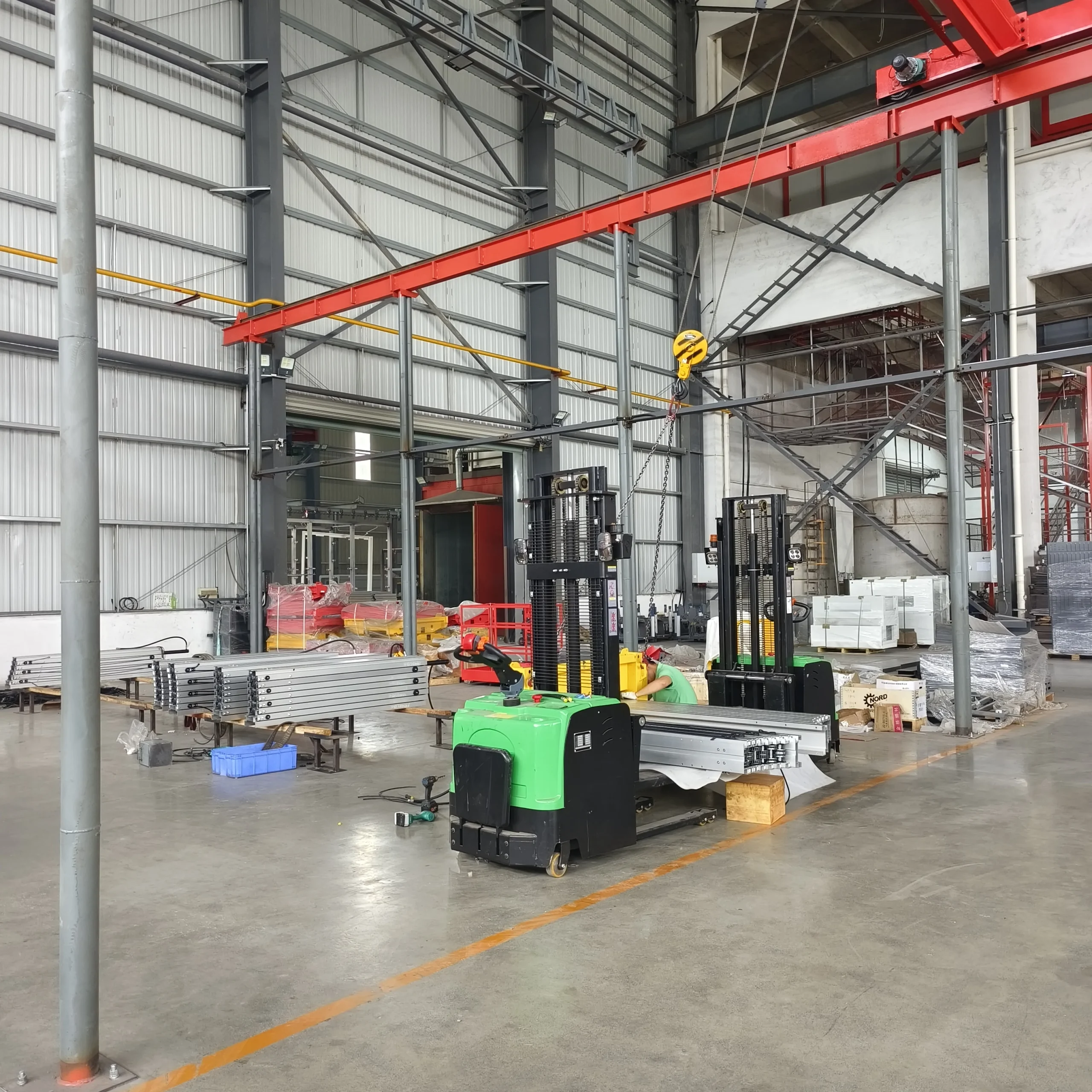 Technician assembling hydraulic power unit and electrical systems
