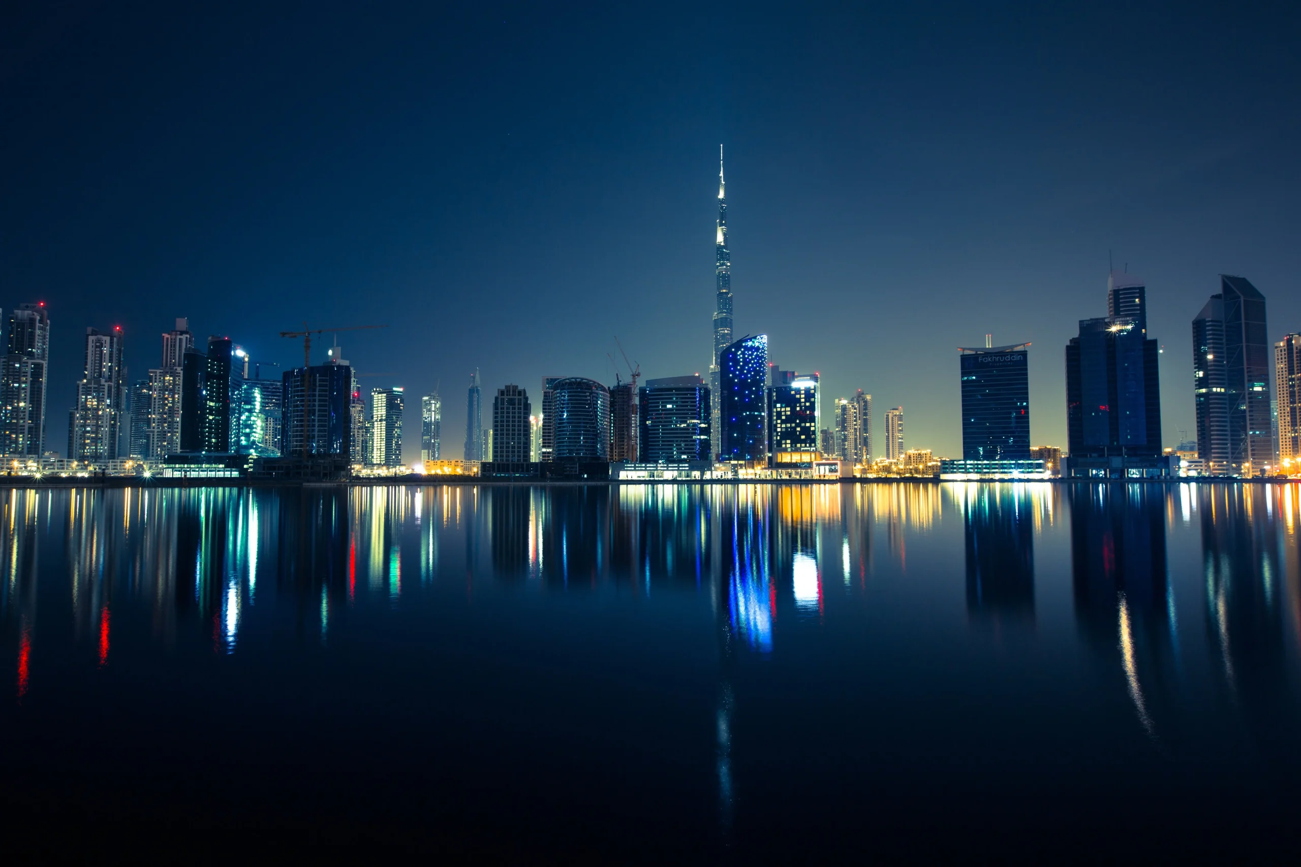Dubai skyline with active construction cranes